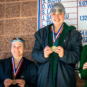 Swimmers with medals after race